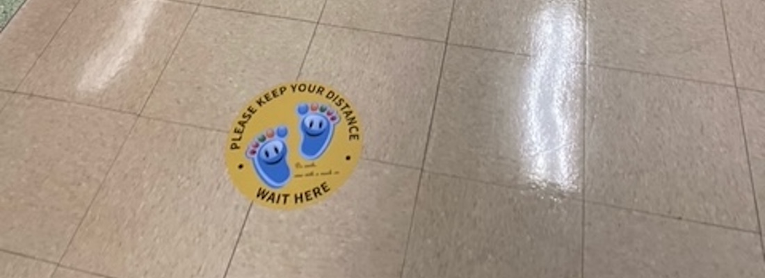 Sticker on the floor to help students social distance